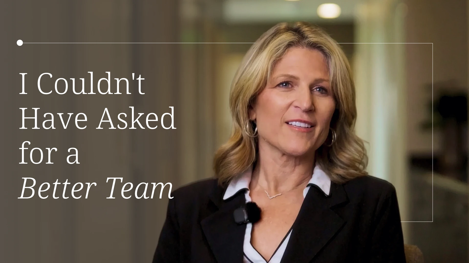 Video thumbnail: smiling woman in a blazer speaking about teamwork; left-side overlay text reads 'I Couldn't Have Asked for a Better Team'.