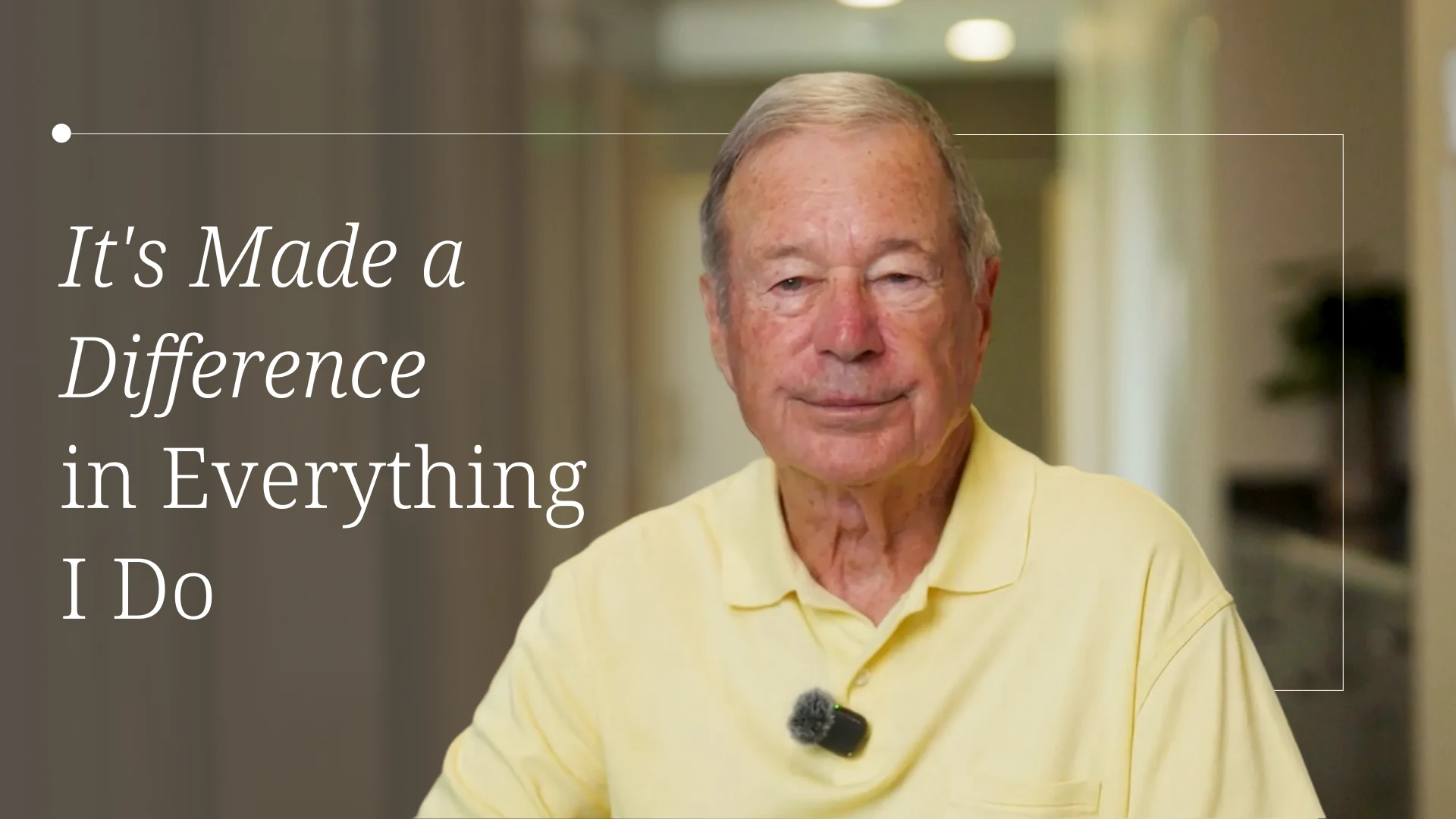 Older man in a pale yellow polo sits in an office with a large inspirational quote on the left: 'It's Made a Difference in Everything I Do'.